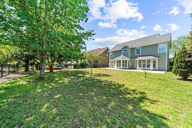 view of yard with a patio and a fenced backyard