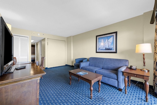 living area with carpet and an office area