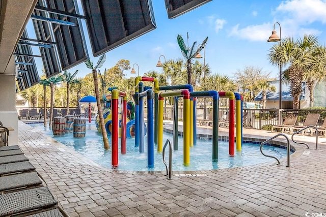 community jungle gym featuring fence