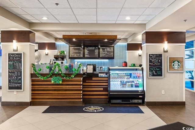 reception area featuring a paneled ceiling