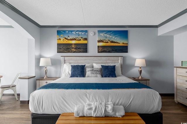 6900 N Ocean Blvd Unit 404, Myrtle Beach, SC 29572 - bedroom featuring a textured ceiling, wood finished floors, and ornamental molding