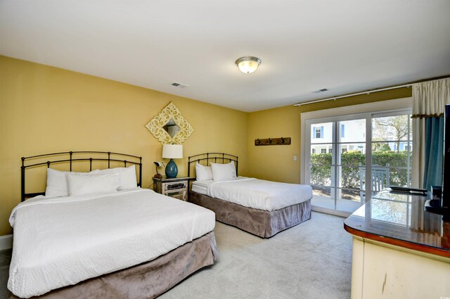 4850 Cantor Ct Unit 202, North Myrtle Beach, SC 29582 - bedroom with access to exterior and carpet