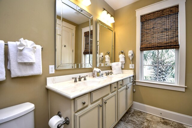 4850 Cantor Ct Unit 202, North Myrtle Beach, SC 29582 - full bathroom with baseboards, double vanity, and toilet