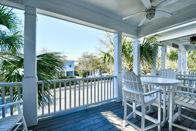 4850 Cantor Ct Unit 202, North Myrtle Beach, SC 29582 - wooden deck featuring a ceiling fan and outdoor dining area