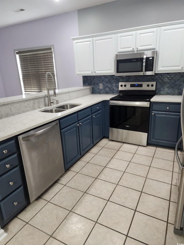 6204 Sweetwater Blvd Unit 6204, Murrells Inlet, SC 29576 - kitchen featuring white cabinets, a sink, stainless steel appliances, light countertops, and blue cabinetry