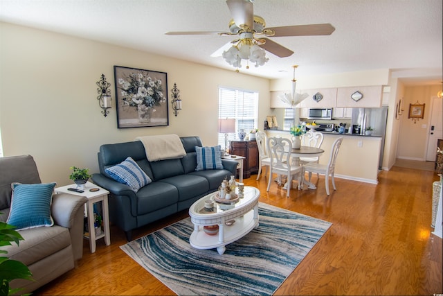 5030 Windsor Green Way Unit 203, Myrtle Beach, SC 29579 - living area with light wood-type flooring and a ceiling fan