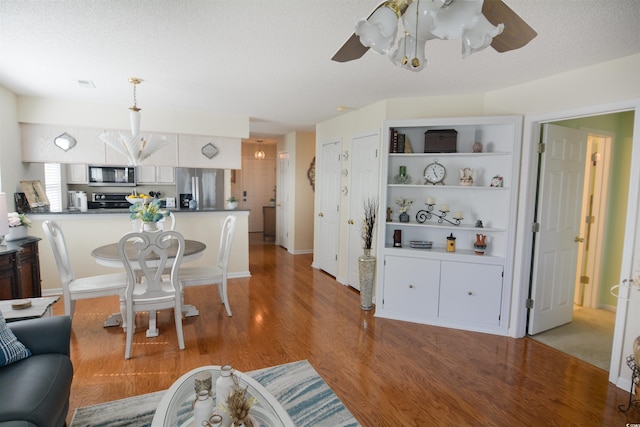 5030 Windsor Green Way Unit 203, Myrtle Beach, SC 29579 - dining area with light wood finished floors, ceiling fan, and visible vents
