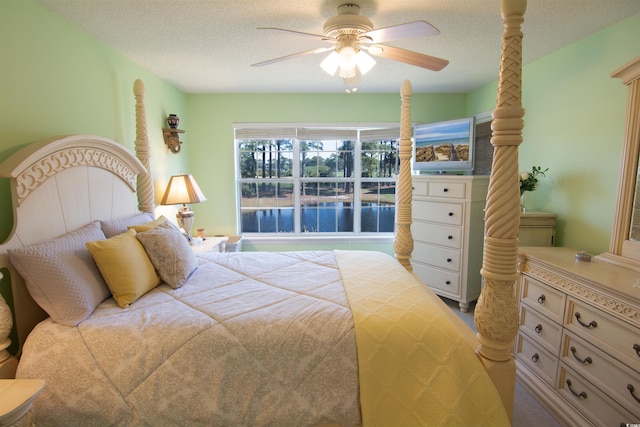 5030 Windsor Green Way Unit 203, Myrtle Beach, SC 29579 - bedroom with ceiling fan and a textured ceiling