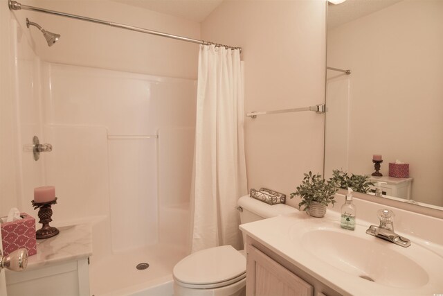 5030 Windsor Green Way Unit 203, Myrtle Beach, SC 29579 - bathroom with toilet, vanity, and a shower with shower curtain