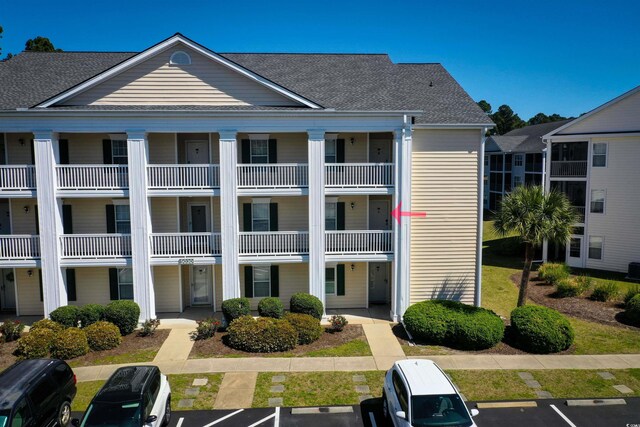 5030 Windsor Green Way Unit 203, Myrtle Beach, SC 29579 - view of building exterior featuring uncovered parking