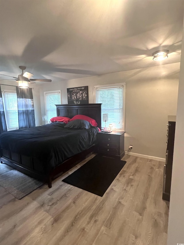 532 Medcalf Dr SW, Sunset Beach, NC 28468 - bedroom featuring baseboards, ceiling fan, and wood finished floors