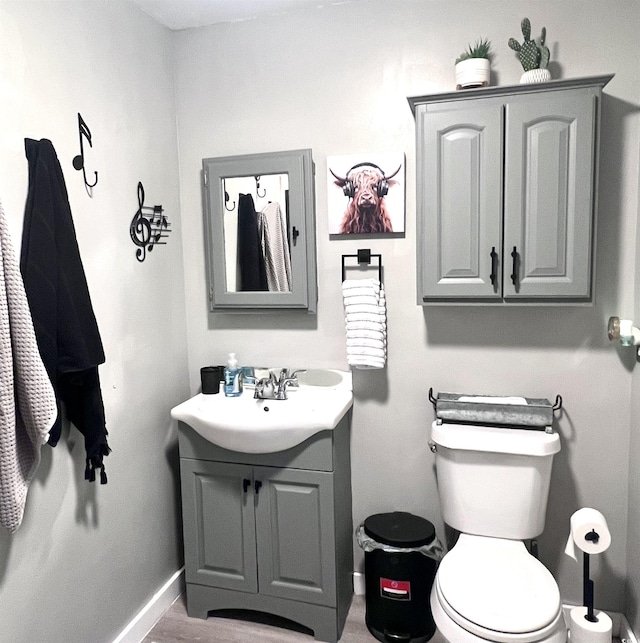 532 Medcalf Dr SW, Sunset Beach, NC 28468 - half bath featuring baseboards, toilet, and vanity