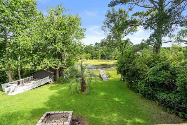 532 Medcalf Dr SW, Sunset Beach, NC 28468 - view of yard with a wooden deck
