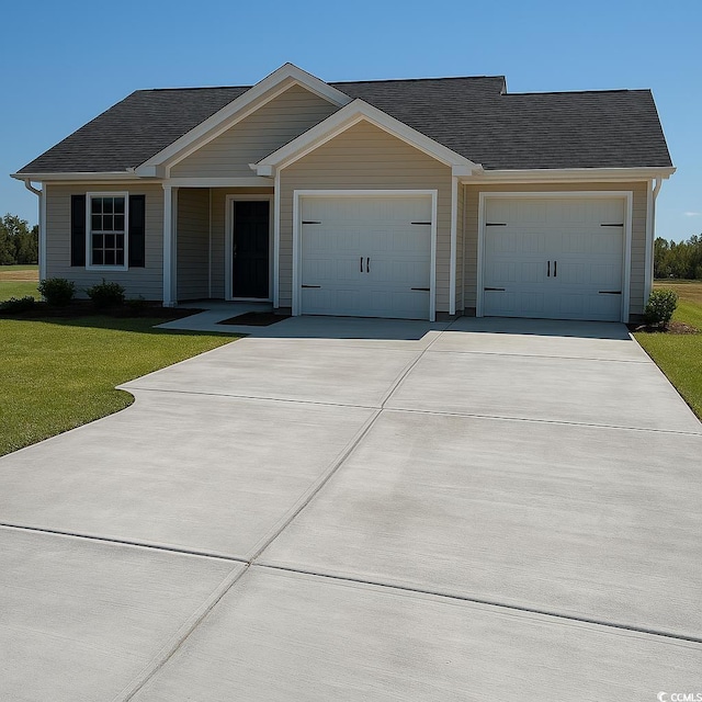 single story home with roof with shingles, concrete driveway, a garage, and a front lawn