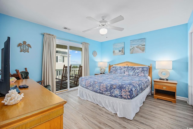 412 Seaside Dr S, Surfside Beach, SC 29575 - bedroom featuring access to outside, light wood-style floors, a ceiling fan, and baseboards