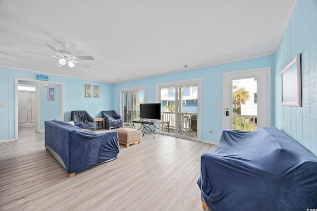 412 Seaside Dr S, Surfside Beach, SC 29575 - living area featuring light wood-style flooring, ceiling fan, baseboards, and ornamental molding