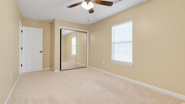 4533 Greenbriar Dr, Little River, SC 29566 - unfurnished bedroom with ceiling fan, a closet, light colored carpet, and baseboards