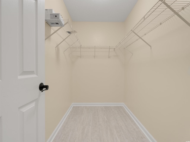4533 Greenbriar Dr, Little River, SC 29566 - walk in closet featuring wood finished floors