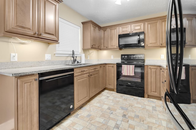4533 Greenbriar Dr, Little River, SC 29566 - kitchen with light stone countertops, brick floor, a sink, and black appliances