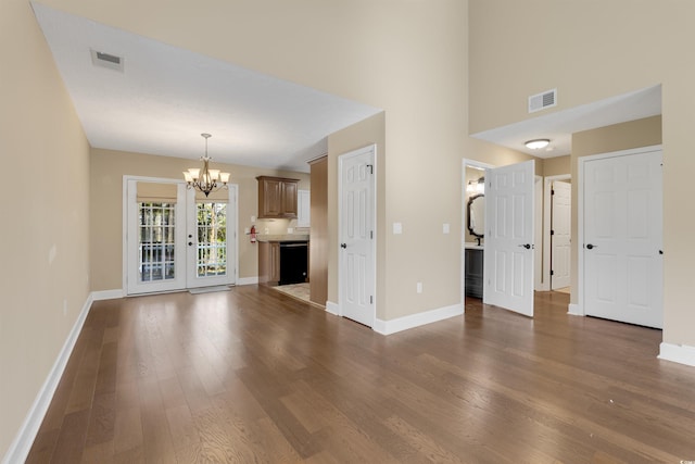 4533 Greenbriar Dr, Little River, SC 29566 - unfurnished living room featuring an inviting chandelier, visible vents, and dark wood-style flooring