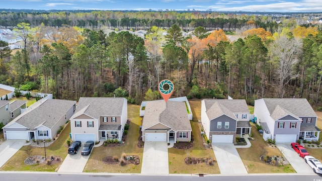 aerial view of residential area with a forest