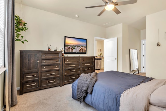 bedroom featuring light carpet and a ceiling fan