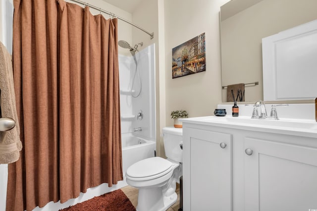 full bath with toilet, shower / bath combo, vanity, and tile patterned flooring