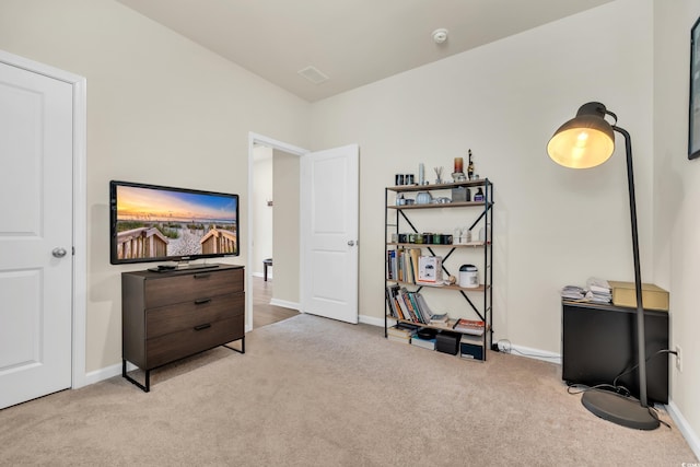 miscellaneous room featuring carpet flooring and baseboards