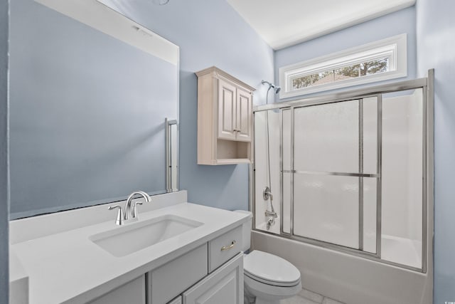 full bathroom with toilet, vanity, and enclosed tub / shower combo