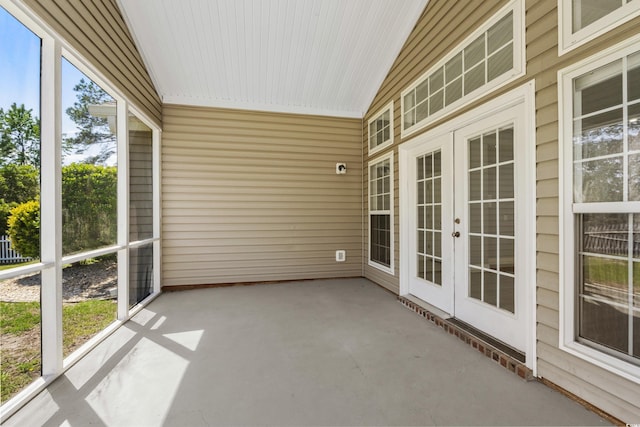 unfurnished sunroom featuring french doors
