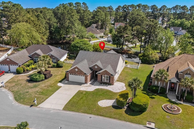 birds eye view of property with a residential view