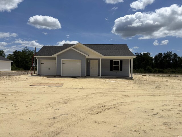 1502 Hardwick Rd, Conway, SC 29526 - view of front of property featuring covered porch, an attached garage, and dirt driveway