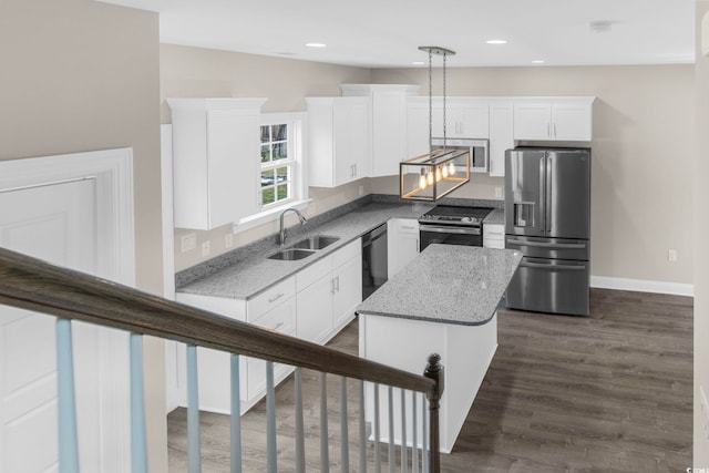 904 62nd Ave N Unit E, Myrtle Beach, SC 29572 - kitchen featuring baseboards, a sink, white cabinetry, and stainless steel appliances