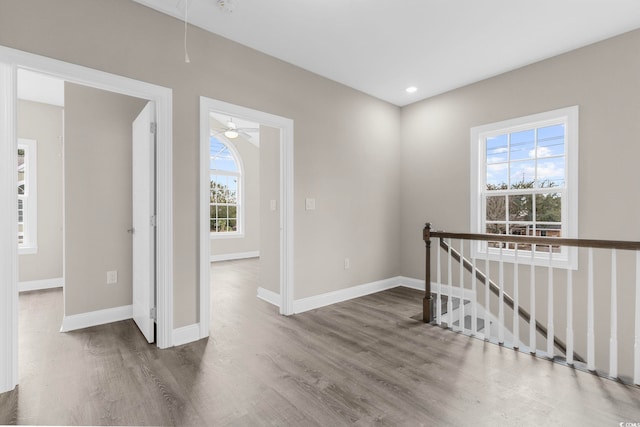 904 62nd Ave N Unit E, Myrtle Beach, SC 29572 - spare room with baseboards, attic access, and wood finished floors