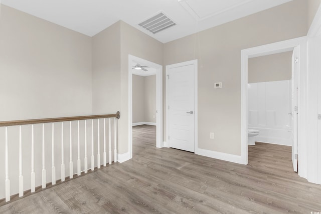 904 62nd Ave N Unit E, Myrtle Beach, SC 29572 - unfurnished room with baseboards, attic access, wood finished floors, and visible vents