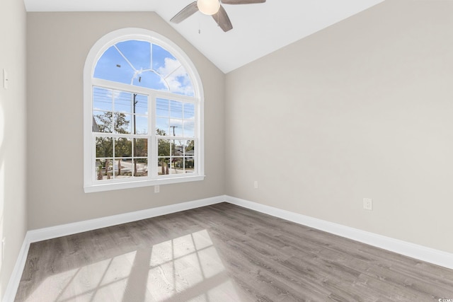 904 62nd Ave N Unit E, Myrtle Beach, SC 29572 - spare room featuring baseboards, ceiling fan, vaulted ceiling, and wood finished floors