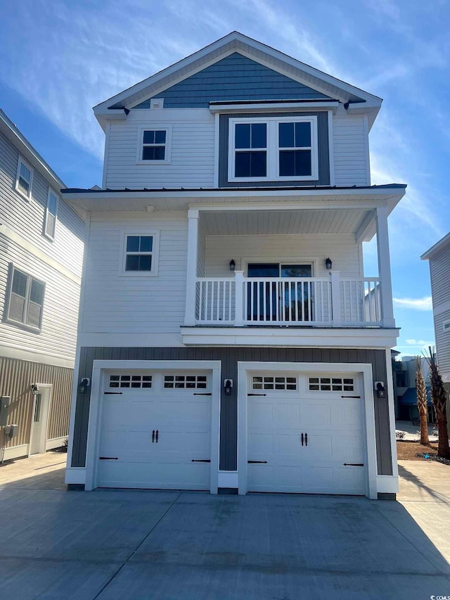 201-E Madison Ct, Myrtle Beach, SC 29577 - raised beach house with an attached garage, driveway, and a balcony