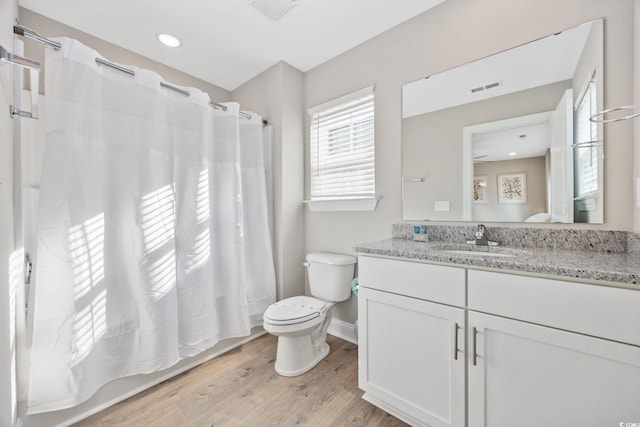 201-E Madison Ct, Myrtle Beach, SC 29577 - bathroom featuring toilet, vanity, wood finished floors, baseboards, and curtained shower