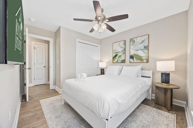 201-E Madison Ct, Myrtle Beach, SC 29577 - bedroom with baseboards, a closet, and light wood-style flooring