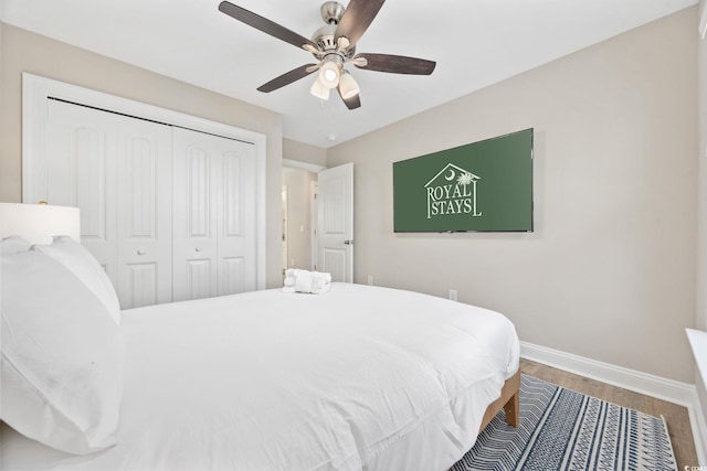 201-E Madison Ct, Myrtle Beach, SC 29577 - bedroom with baseboards, a closet, wood finished floors, and ceiling fan
