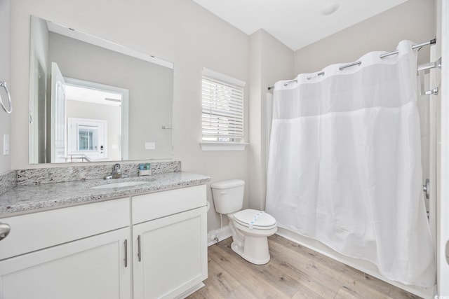 201-E Madison Ct, Myrtle Beach, SC 29577 - full bathroom featuring wood finished floors, vanity, toilet, and shower / bath combination with curtain