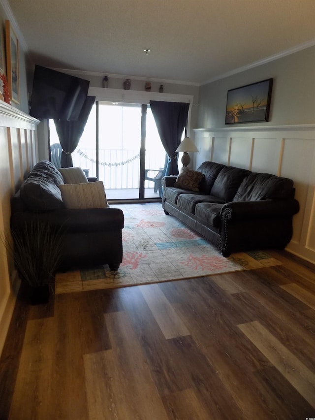 305 N Hillside Dr N Unit 103, North Myrtle Beach, SC 29582 - living area with crown molding, a wainscoted wall, wood finished floors, and a decorative wall