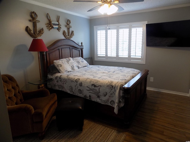 305 N Hillside Dr N Unit 103, North Myrtle Beach, SC 29582 - bedroom featuring dark wood-style floors, ornamental molding, baseboards, ceiling fan, and a textured ceiling