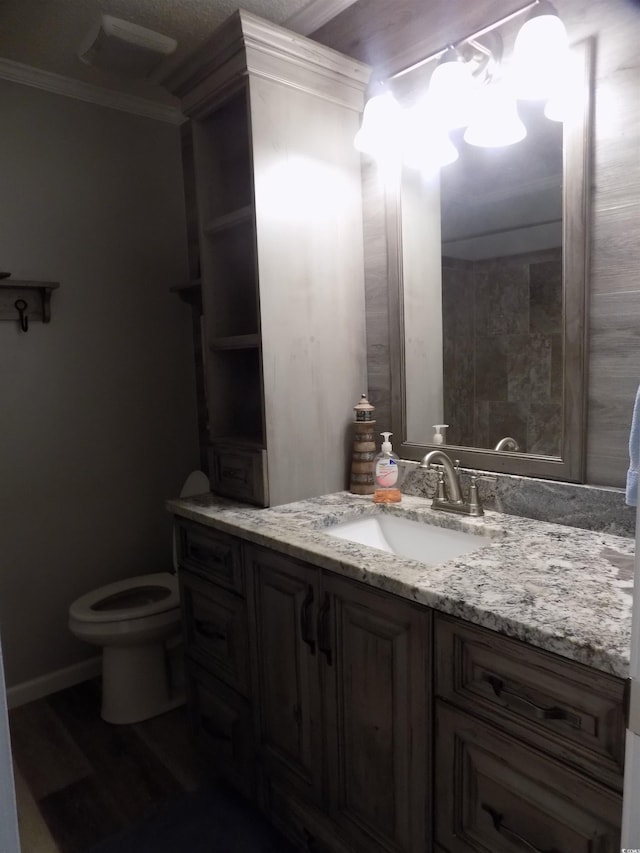 305 N Hillside Dr N Unit 103, North Myrtle Beach, SC 29582 - bathroom with vanity, toilet, ornamental molding, and wood finished floors