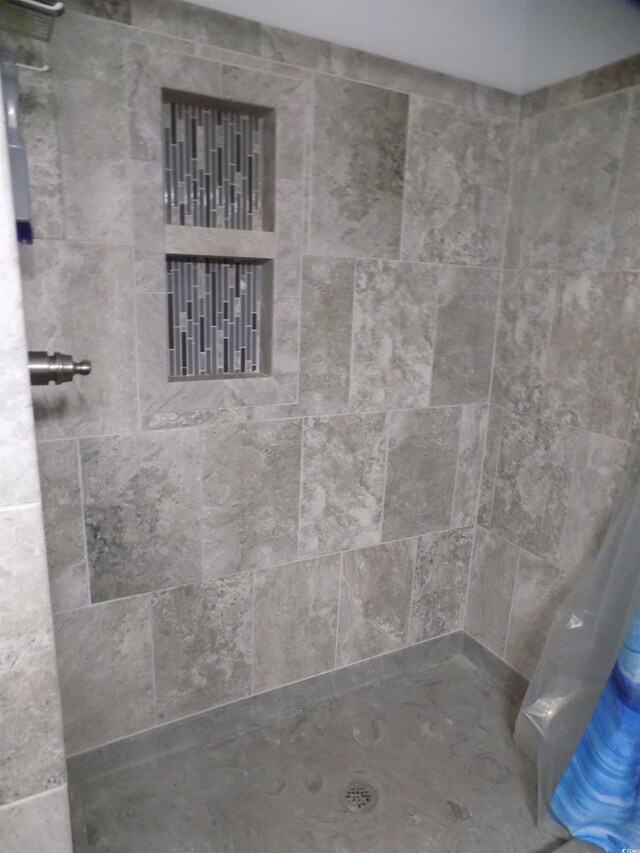305 N Hillside Dr N Unit 103, North Myrtle Beach, SC 29582 - full bathroom featuring tiled shower