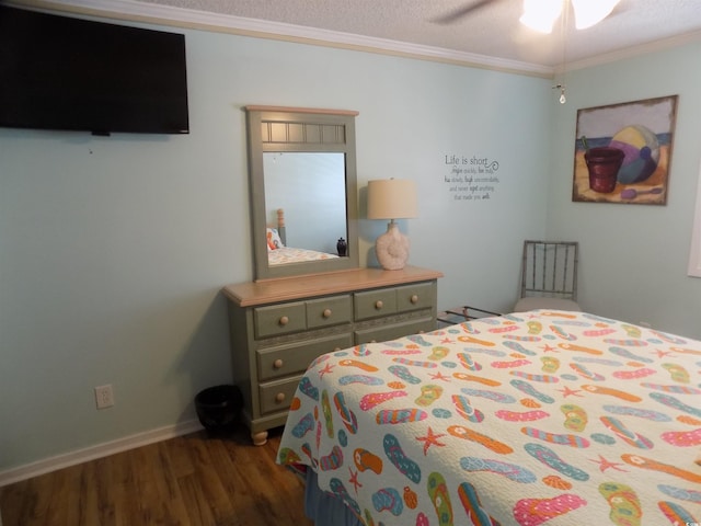 305 N Hillside Dr N Unit 103, North Myrtle Beach, SC 29582 - bedroom featuring dark wood-style floors, ornamental molding, ceiling fan, and baseboards