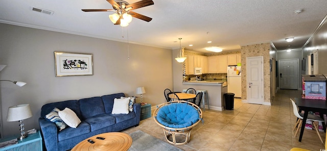 1100 Commons Blvd Unit 606, Myrtle Beach, SC 29572 - living area with ceiling fan, crown molding, light tile patterned floors, and baseboards