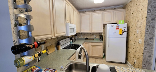 1100 Commons Blvd Unit 606, Myrtle Beach, SC 29572 - kitchen with white appliances, crown molding, and light countertops