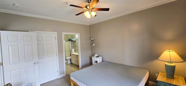 1100 Commons Blvd Unit 606, Myrtle Beach, SC 29572 - carpeted bedroom featuring ornamental molding, ensuite bath, baseboards, and ceiling fan