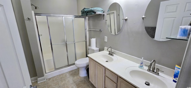 1100 Commons Blvd Unit 606, Myrtle Beach, SC 29572 - bathroom featuring toilet, a shower stall, tile patterned floors, and double vanity